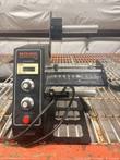 U.S. Solid 1150D automatic label dispenser on a wire shelf