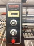 Control panel of the 1150D label dispenser with counter, length and speed knobs and power button