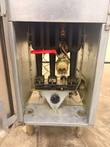 Fryer cabinet with door open: three cast burners, red gas valve and thermostat dial
