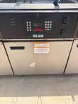 Giles fryer control panel with keypad and timer, and warning label on the cabinet door