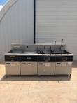 Giles fryer battery: water vat, dump station and two fryers on casters, front view