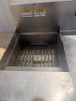 Empty Giles vat with heating elements and Caution labels for water use only, no sanitizer