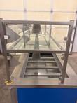 End view of the two-tier glass sneeze guard above the cold pan wells on the Atlas Metal counter