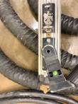 Top-down close-up of EFD MINAC transformer mounting hardware, lifting eye and green indicator button