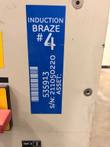 Blue Induction Braze #4 label on the generator cabinet showing a barcode and serial number