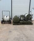 ARFF skid with a separate wheeled hose reel cart standing beside it.