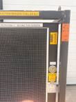 Chiller top corner with a 58"L x 52"W x 73"H, 1,265 lb weight label, fluid pressure gauge and data plate.