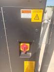 Chiller electrical panel with a red and yellow rotary disconnect, arc flash warning and electrical hazard labels.