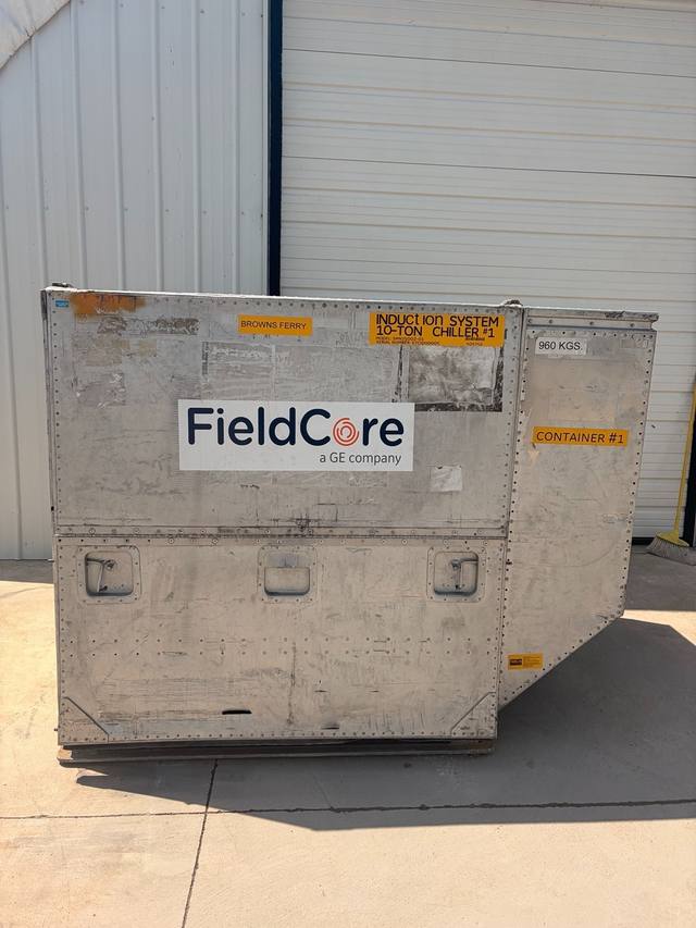 Aluminum shipping container with FieldCore logo, three latch handles on the lower door and a Container #1 label.