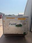 End of the aluminum container with a FieldCore logo, 960 KGS tag and Induction System 10-Ton Chiller #1 label.