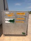 Closed aluminum shipping container with an orange Induction System 10-Ton Chiller #1 label and a FieldCore logo.