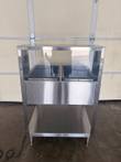 Front of the stainless steel steam table with clear sneeze guard shelf, two wells, front panel and undershelf.