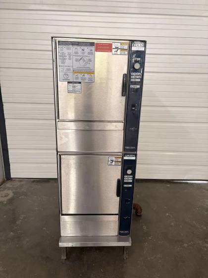 Groen double-stack boilerless steamer, front view, two stainless doors with blue control panels