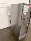 Groen double-stack boilerless steamer at an angle, stainless side panel and two doors with control panels