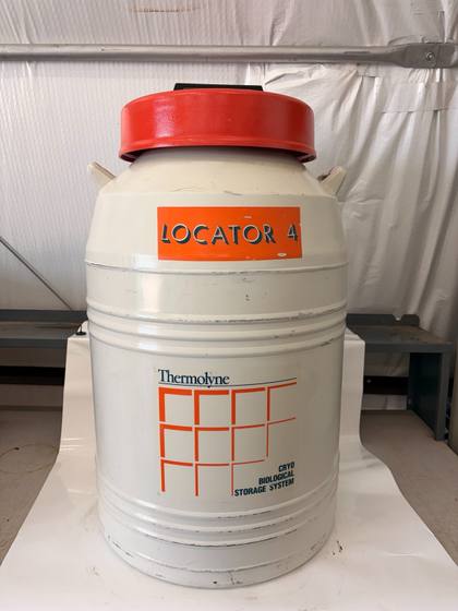 Thermolyne Locator 4 cryo biological storage dewar, cream body with red lid and orange label