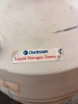 Worn, peeling Charlesson Liquid Nitrogen Dewar label on the cream tank body