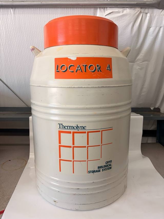Thermolyne Locator 4 cryo biological storage dewar, cream body with orange lid and orange label