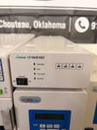 Jasco LC-Net II/ADC interface box with status lights and power switch, above a CO-2065 Plus column oven