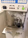 Jasco HPLC pump with its door open, showing the twin pump heads and stainless tubing