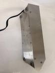 Underside of the stainless steel stirrer housing with rubber feet, screws and black power cord
