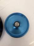 Underside of the blue rotor lid with central stem and black O-ring, rotor body at left edge
