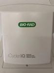 Cream front cover of the iCycler iQ with green Bio-Rad badge and Multicolor Real-Time PCR text
