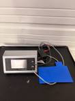 Harvard Apparatus homeothermic monitor with blue pad, probe cables and power adapter on a black tray
