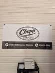 Seward Stomacher 80 laboratory blender on a cart with bags beside it and a Chupp Surplus banner behind