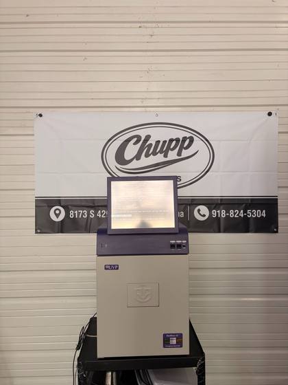 UVP GelDoc-It imaging system on a black cart with a 15-inch screen on top, Chupp Surplus banner behind