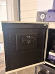 Open black door of the UVP imaging cabinet with a viewing window, part of a purple benchtop unit at right