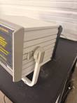 Side of the HDI PulseWave CR-2000 showing the ribbed housing and swing-out carry handle