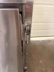 Chrome door hinge and screws on the right side of the stainless Winston CVap cabinet frame