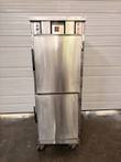 Winston CVap holding cabinet, stainless steel with two half-doors, black handles and casters, doors closed