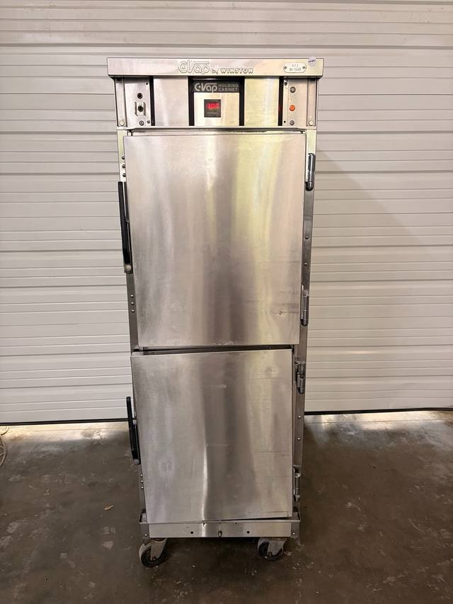 Winston CVap holding cabinet, stainless steel with two half-doors, black handles and casters, doors closed