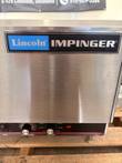 Lincoln Impinger nameplate above the front control panel with conveyor speed and oven temp knobs