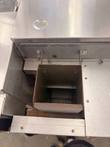 Top-down view of the Lincoln Impinger oven's square flue opening and bracketed sheet metal