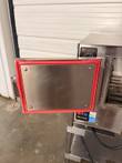 Open door of the Groen INTEK steamer with red silicone gasket and latch, controls visible behind it
