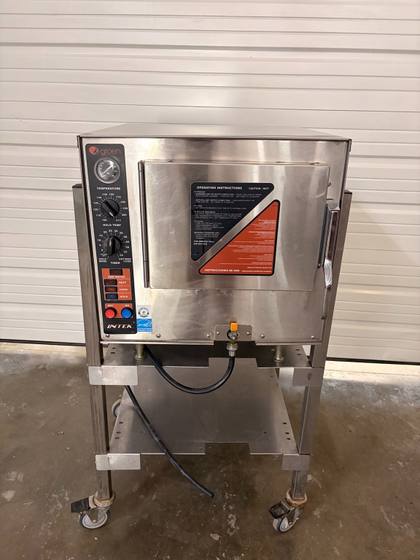 Front of Groen INTEK electric convection steamer on a casters stand, door closed with operating decal