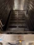 Inside of the steamer cooking chamber: slotted INTEK floor plate, side rack rails and rear fan vent