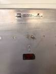 EPCO data plate above a latch and a red caution this surface may be hot label on the cabinet