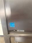 Energy Star label and serial number plate on the stainless front panel of the AccuTemp steamer