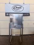 Front of AccuTemp Evolution boilerless steamer on a stainless stand with casters, in front of a Chupp Surplus banner