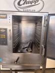 AccuTemp Evolution boilerless steamer with door open, showing wire racks, control panel and drain handle