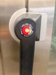 Black door handle with an Advanced Closed System (ACS) badge on the stainless Convotherm combi oven door