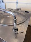 Bent faucet spout and lever valve on top of the Cleveland steam jacketed kettle