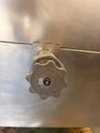 Cleveland-marked drain valve handwheel on the steam kettle