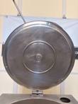 Underside of the raised Cleveland kettle lid with hinge