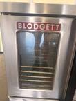 Blodgett convection oven door with stainless frame, glass window and five wire racks visible inside