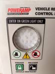 Green-light signal lens, forklift icons and engage and release buttons on the Poweramp iDock panel