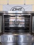 Upper Lang oven cavity with both doors open, four wire racks and the rear convection fan